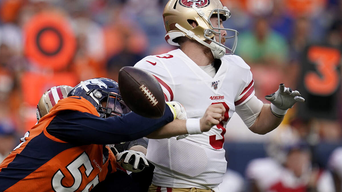 Denver outside linebacker Bradley Chubb forces San Francisco quarterback C.J. Beathard to fumble during Monday’s preseason game. Beathard is battling Nick Mullens to back up starter Jimmy Garoppolo.