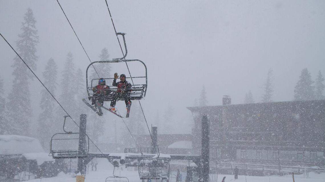 Skiers enjoy a snowy lift ride at Sugar Bowl Resort amid inclement weather. On Thursday a missing snowboarder was rescued near the resort.
