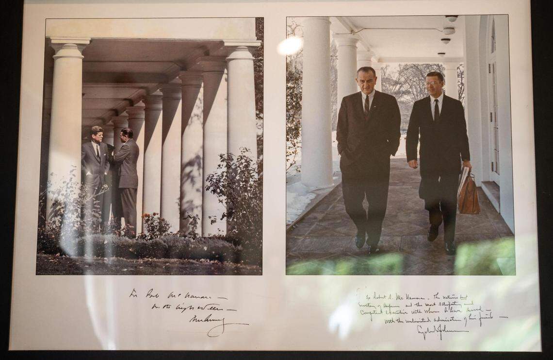 Craig McNamara’s father, Robert McNamara, right, who was secretary of defense under Presidents John F. Kennedy, left, and Lyndon B. Johnson, is pictured in photos now hanging in the younger McNamara’s office at his organic walnut farm on Aug. 18 near Winters.