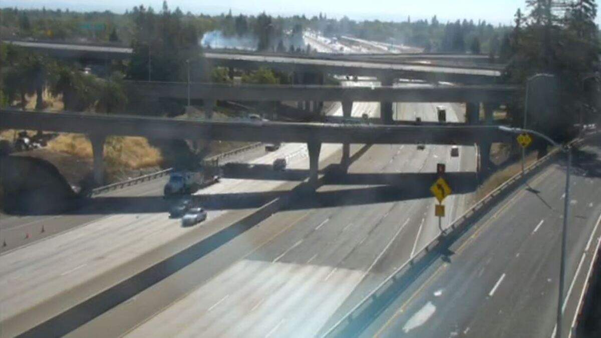 Smoke from a grass fire burning near Highway 50 and the Capital City Freeway drifts over roadways around 8:50 a.m. Wednesday, June 17, 2020.
