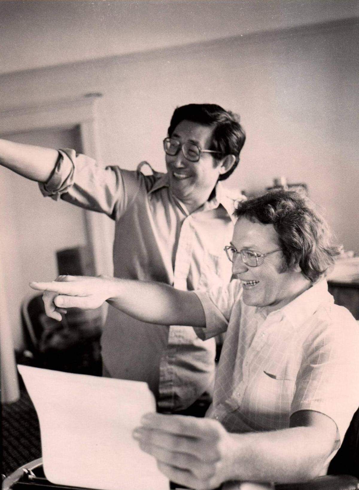 K.W. Lee, left, and Steve Chanecka work on an issue of Koreatown Weekly in 1979.