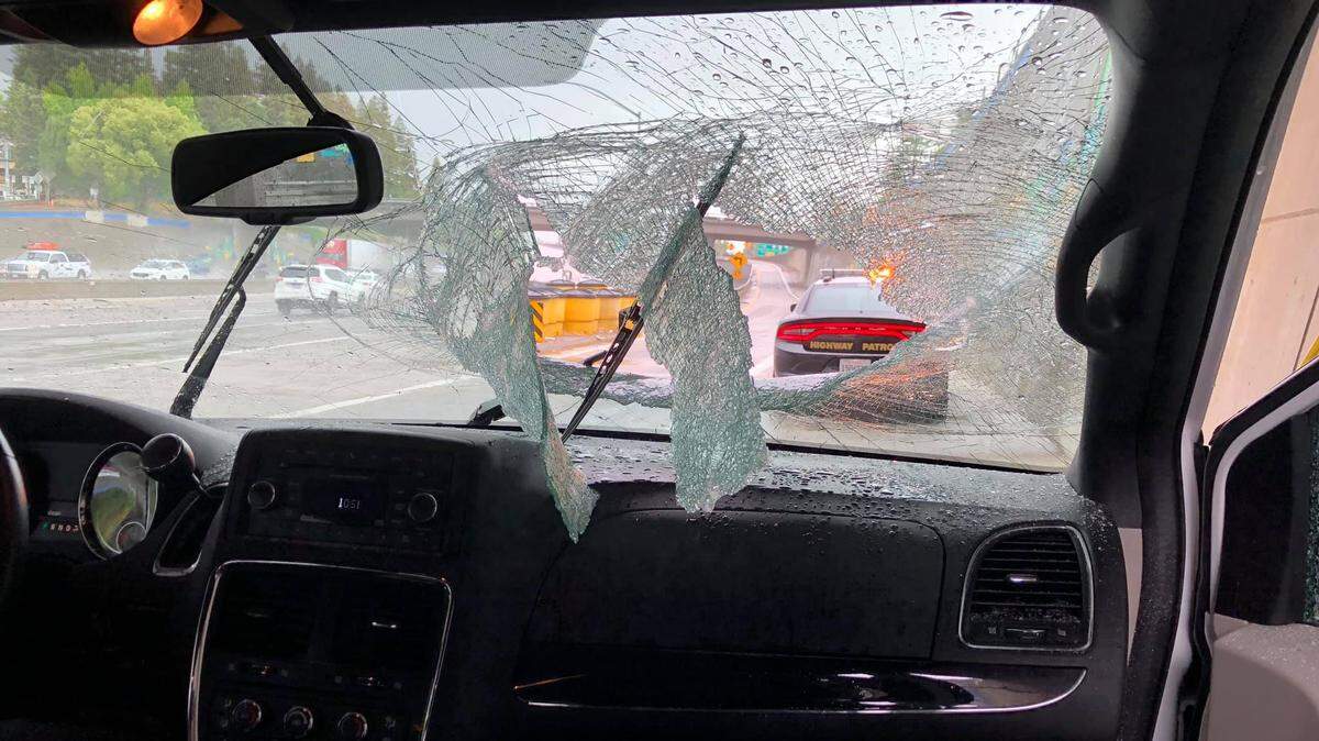 A homeless man was arrested after throwing a stolen Caltrans tripod onto Interstate 5 Thursday, leading to a medical emergency for the van’s occupants, CHP said.