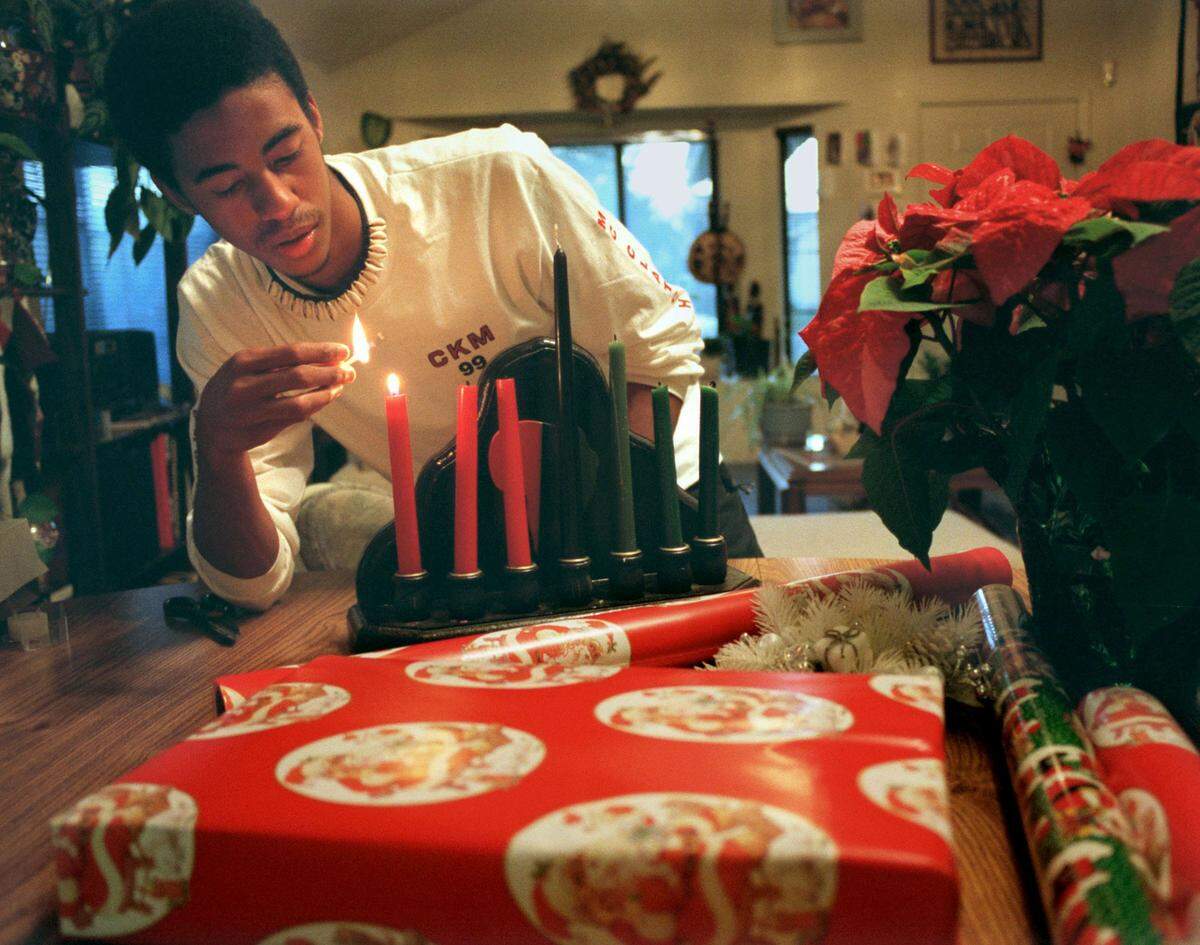McClatchy High School junior Kahlfani Watson celebrates both Kwanza and Christmas at home in 1999.