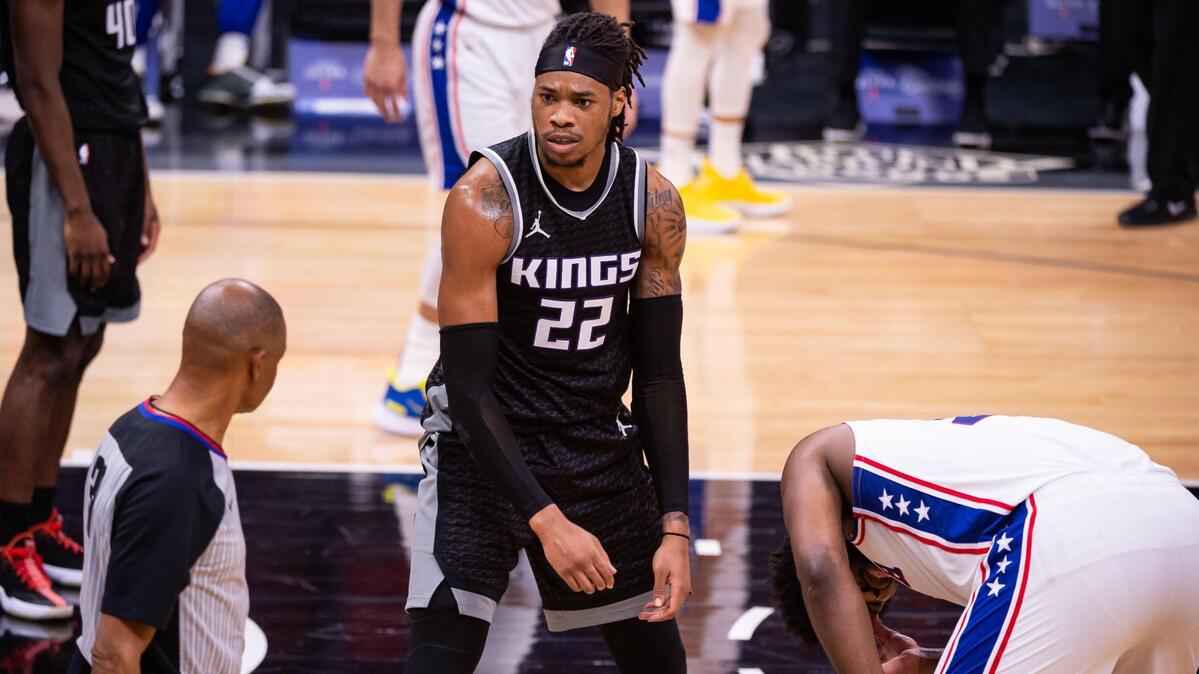 Sacramento Kings center Richaun Holmes (22) reacts as he is called for fouling Philadelphia 76ers center Joel Embiid (21) during the first half of the NBA game Tuesday, Feb. 9, 2021, at Golden 1 Center in Sacramento.