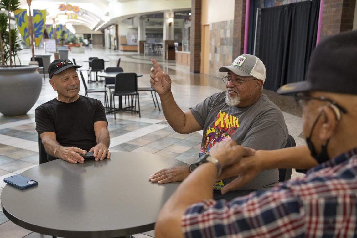 Mall walkers Paul Walker, right, Vernon Dozier, center, and Ken Wade reminisce at Sunrise Mall in Citrus Heights on Sept. 16.