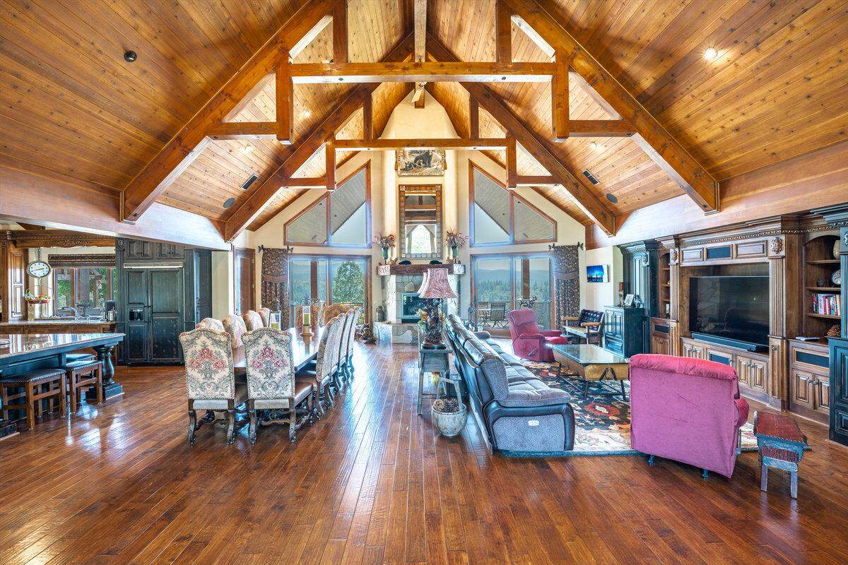 The home’s interior design includes custom woodwork and beams. The owners traveled far to source structural materials, including from a lumber mill in Washington.