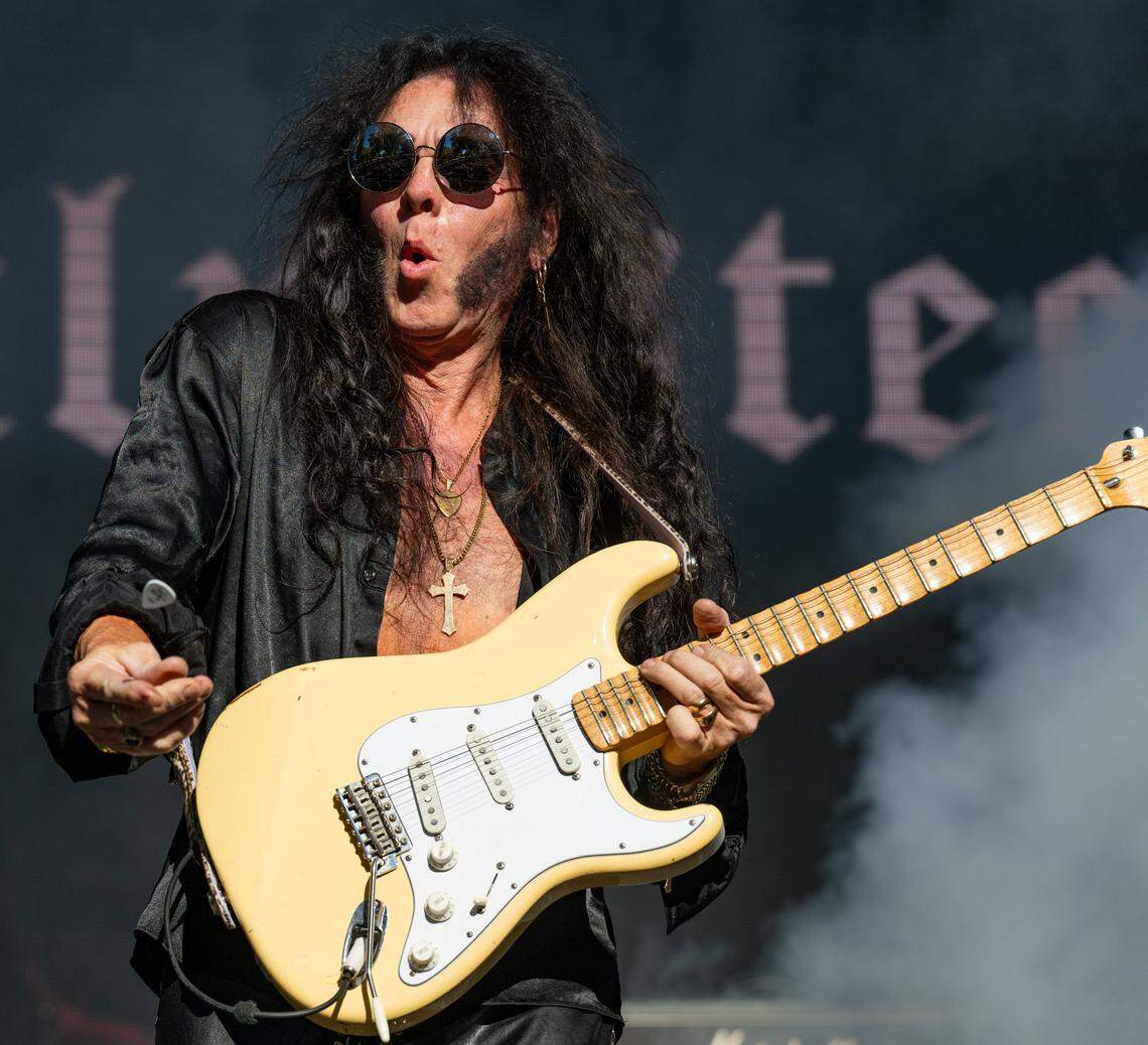 Swedish-American heavy metal guitarist Yngwie Malmsteen tosses a pick to the audience during his performance at the Aftershock festival on Friday, Oct. 3, 2025, in Discovery Park in Sacramento. 