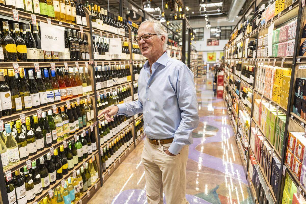 CEO Eric Stille walks through the wine and spirits section at Nugget Market’s new Rocklin location on Monday. Nugget Market opened its newest store on Wednesday