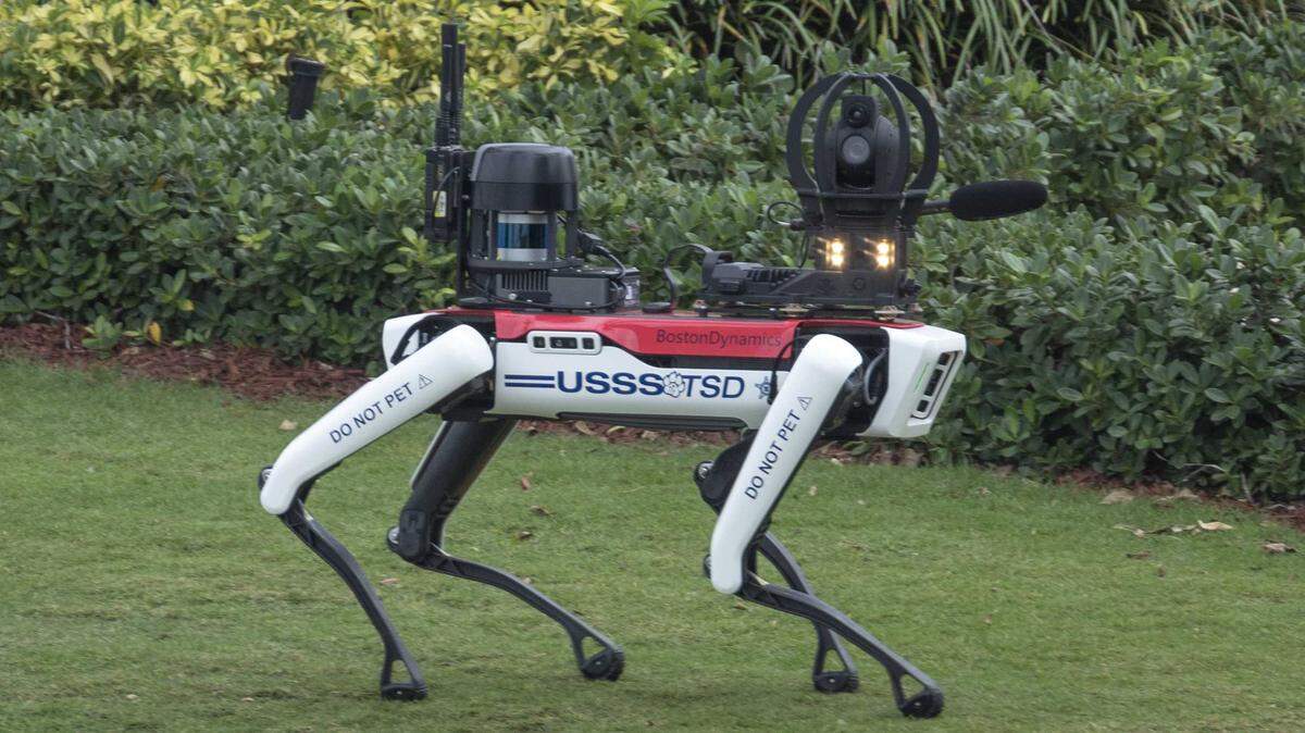 A U.S. Secret Service robot dog manufactured by Boston Dynamics patrols the grounds at President Donald Trump's Mar-a-Lago resort in 2024. Caltrans has deployed similar robots, operated remotely and outfitted with security systems, to assess their effectiveness in deterring theft and conducting hazardous inspections.