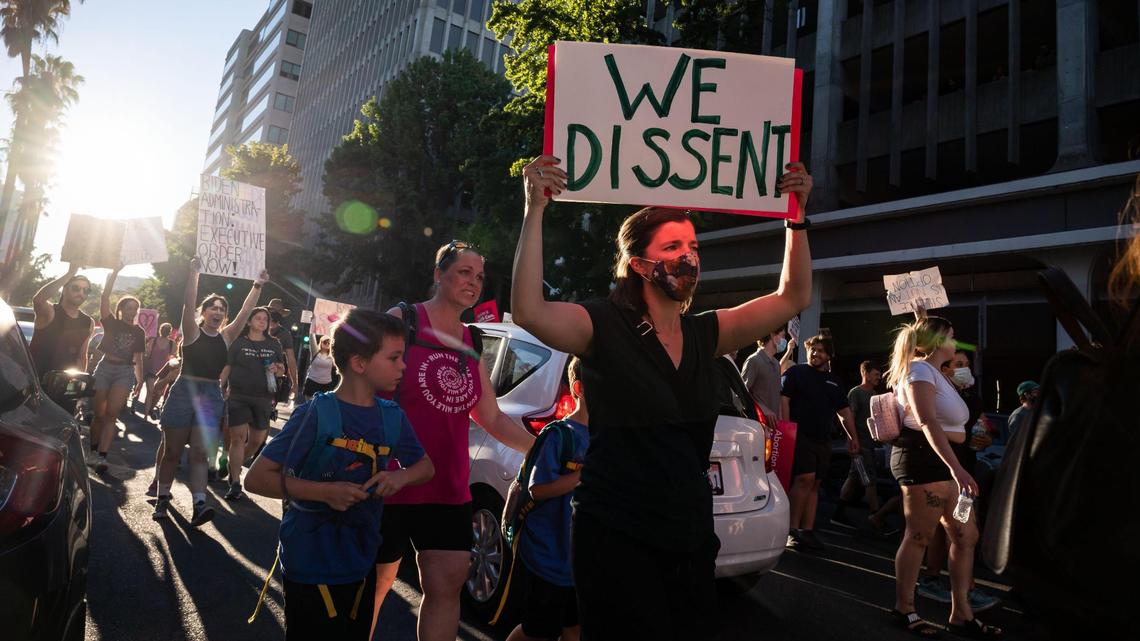 Hundreds of abortion-rights supporters marched outside the state Capitol following announcement of the Roe v. Wade decision.