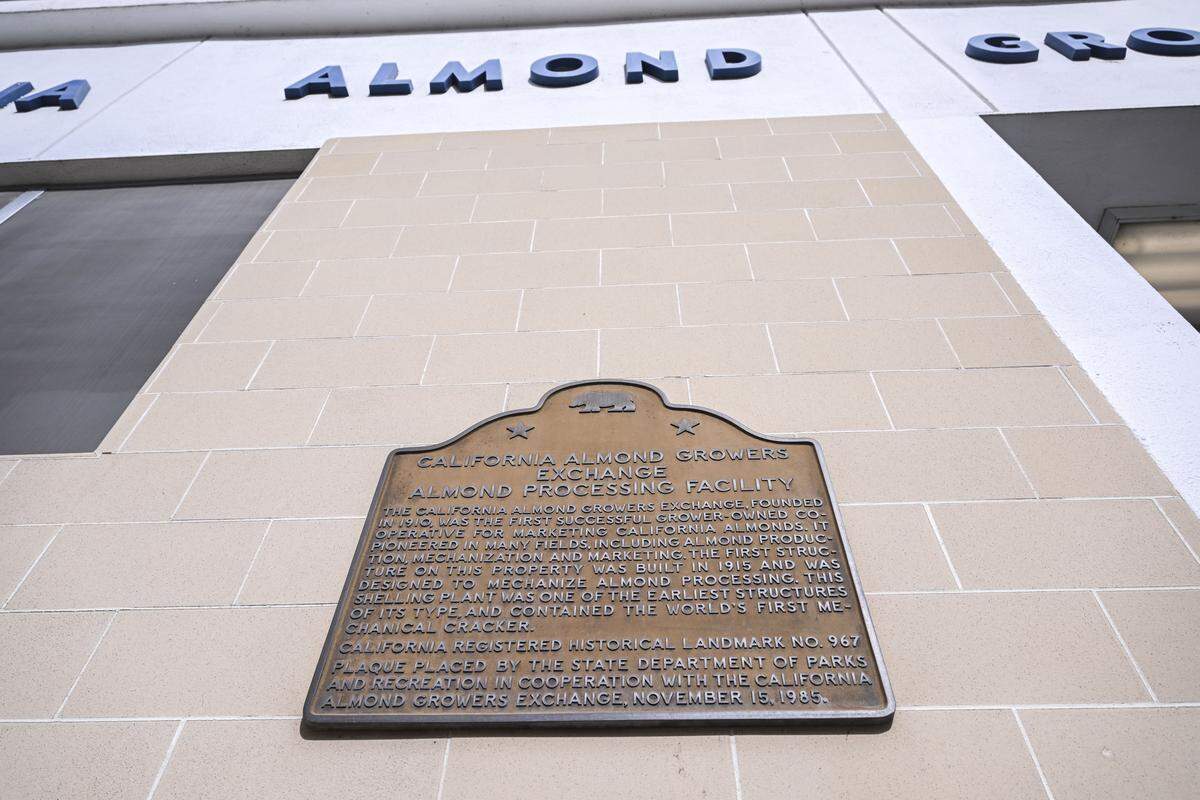 A California Registered Historical Landmark is displayed at the Blue Diamond Sacramento plant on Nov. 11. According to the plaque, Blue Diamond was the first successful co-operative of its kind that marketed almonds from California.