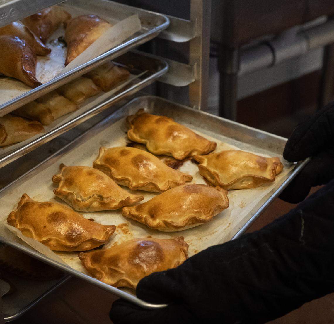 Fresh empanadas get their finishing touches at Forgotten Bakery in Sacramento.