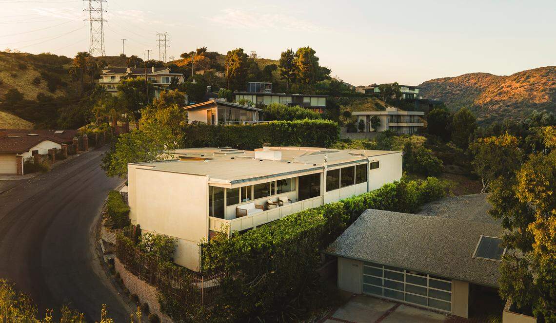 The home has wall-​length windows that allow in the sparkling views — and natural light.