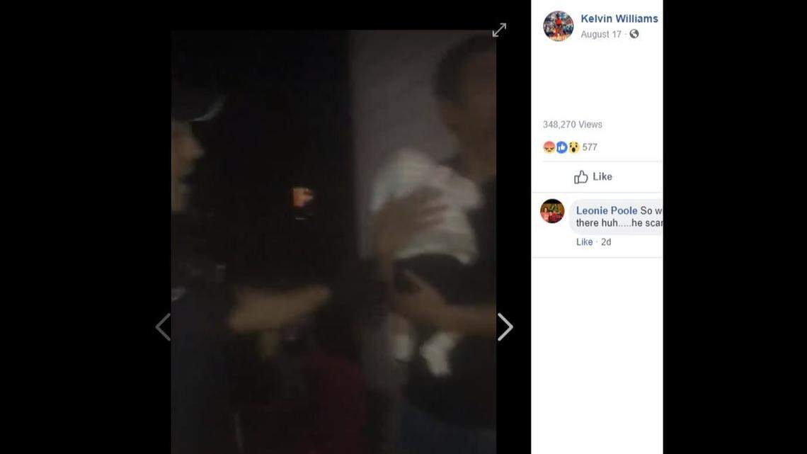 Ray Brown, 33, holds his 2-month-old son moments before police used a stun gun on him during a confrontation Friday night at a back yard barbecue in Michigan in a video shot by neighbor Kelvin Williams.