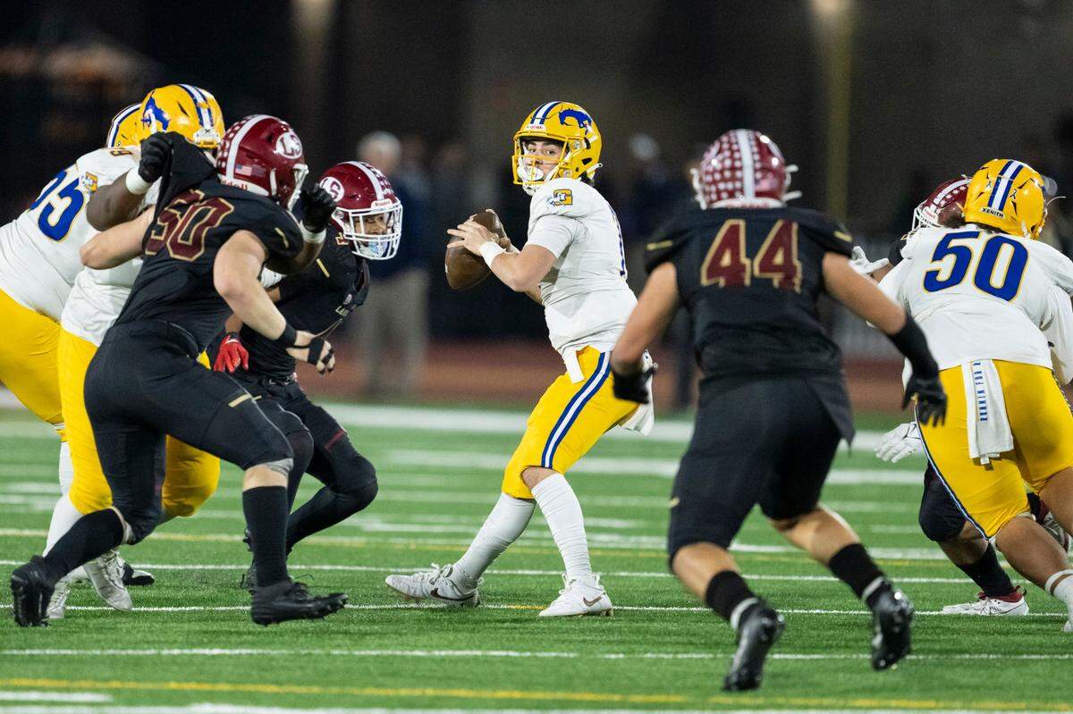 Grant Pacers quarterback Luke Alexander (7) looks to pass downfield in the first half of the CIF Division 2-AA state football championship against the La Serna Lancers on Friday, Dec. 8, 2023, at Saddleback College in Mission Viejo.