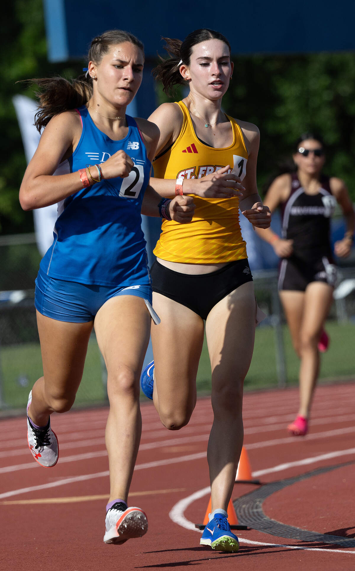 Davis’ Norah Feldt, left, passes St. Francis runner Grace Dunham in the 1600 meter race at the CIF Sac-Joaquin Section Masters Track Championship at Davis High School in Davis, Calif., Saturday, May 18, 2024. Feldt won the race with a time of 4:56.10, Dunham was second at 5:03.17.