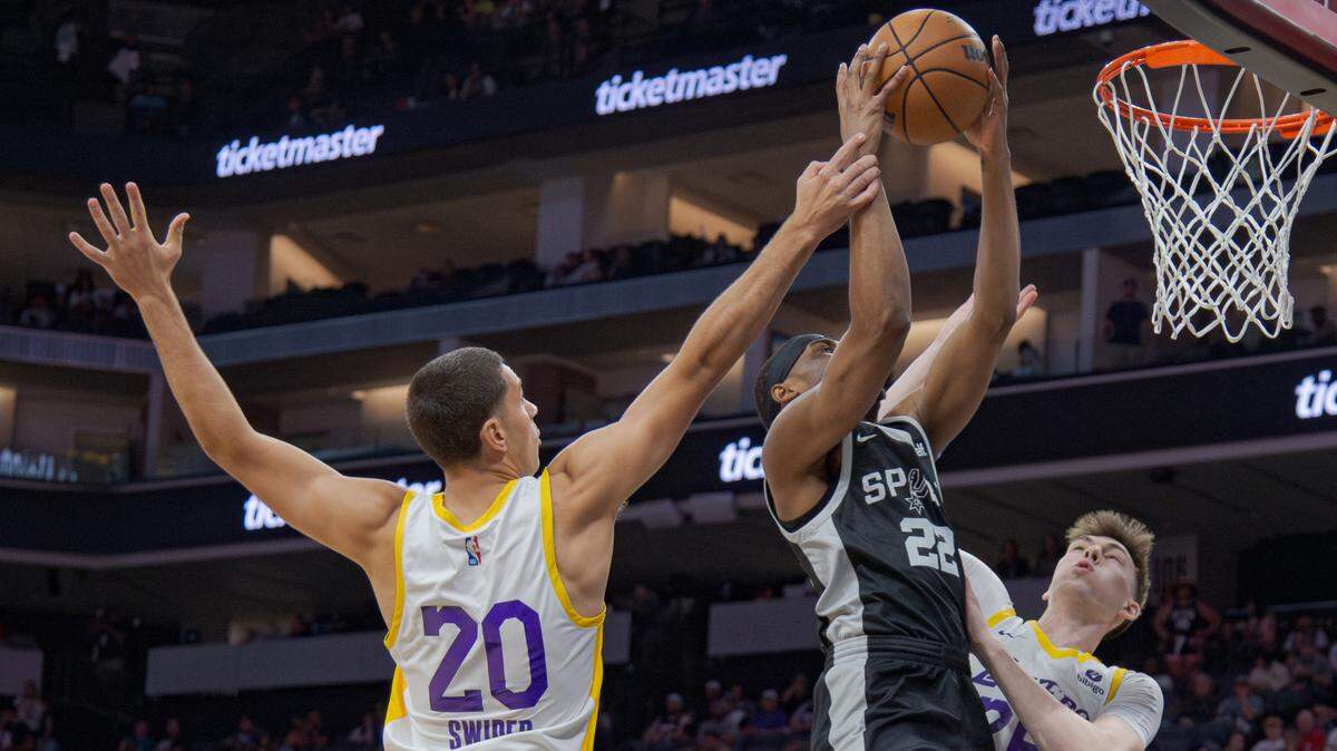The San Antonio Spurs’ Malaki Branham (22) puts up a shot over Los Angeles Lakers’ Cole Swider (20) and Colin Castleton (26) during the California Classic on Wednesday, July 5, 2023, at Golden 1 Center.