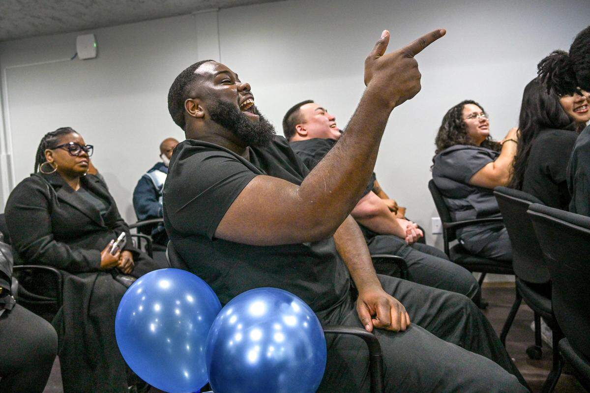 Graduate James Majors, 24, celebrates as he watches classmates receive certificates from TSQ Nursing Academy’s certification program in March at the CARE Campus Sacramento. Majors, who is married with a 5-year-old, said he is looking forward to moving forward with his health care career.