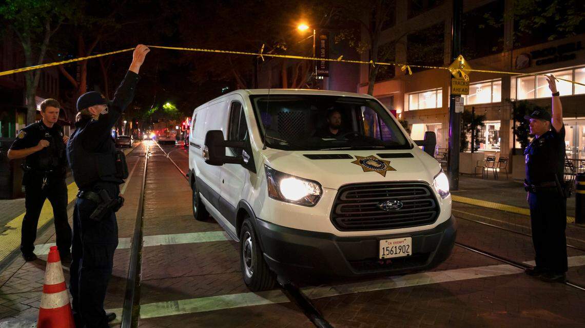 A coroner’s van leaves the scene at 9th and K Street after the mass shooting on April 3, 2022, in downtown Sacramento.