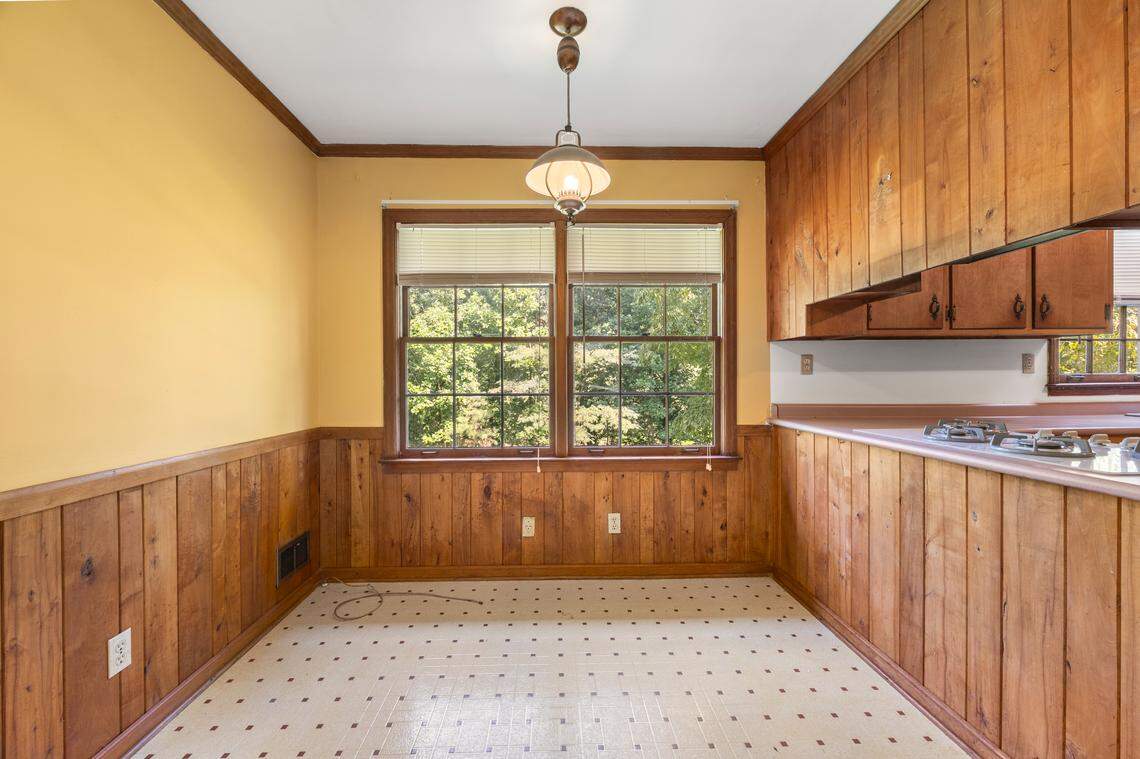 The panel-matching kitchen has plenty of counter space and a waffle breakfast area.