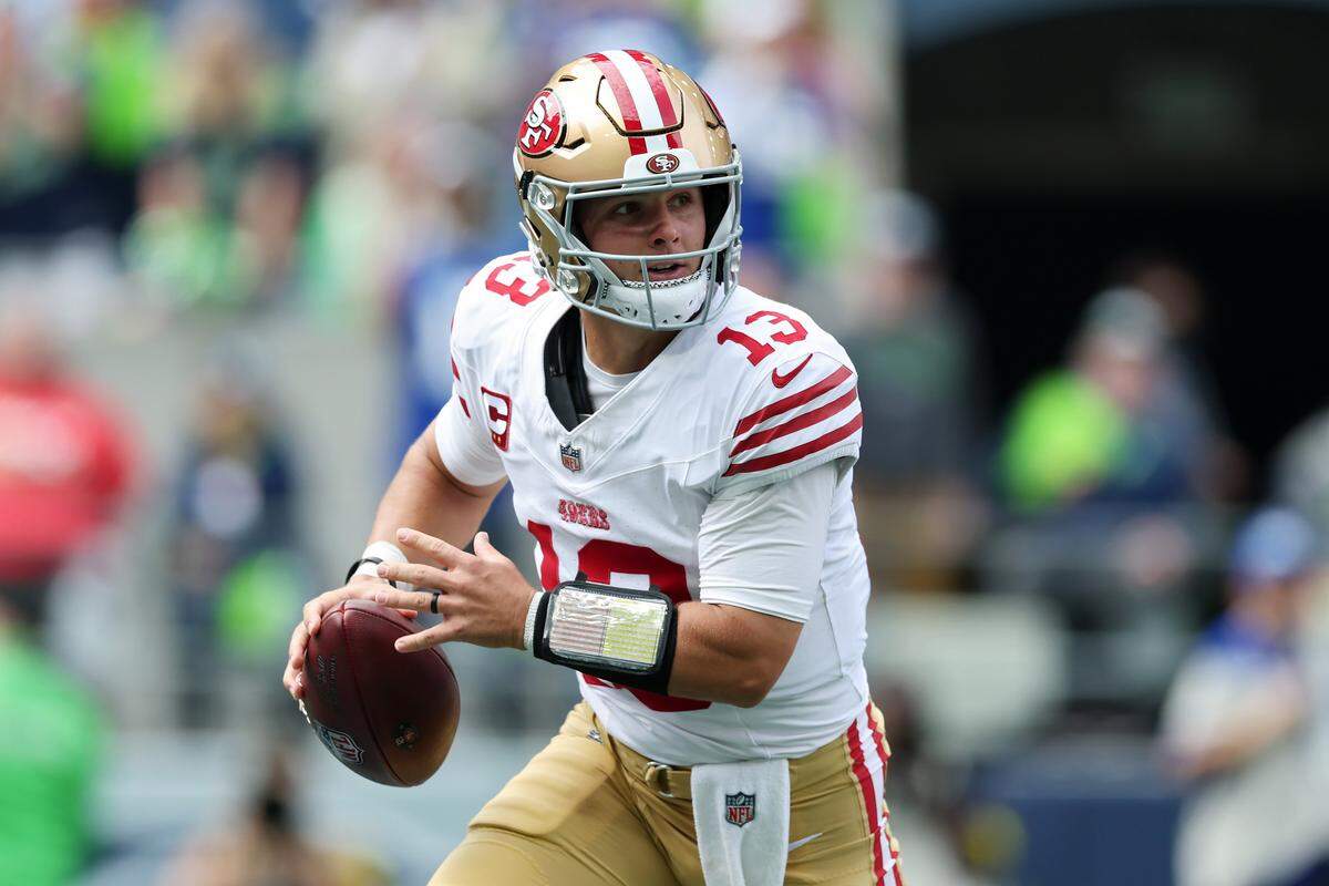 Quarterback Brock Purdy of the San Francisco 49ers looks to pass the ball against the Seattle Seahawks during the game at Lumen Field on Sept. 7, 2025, in Seattle.