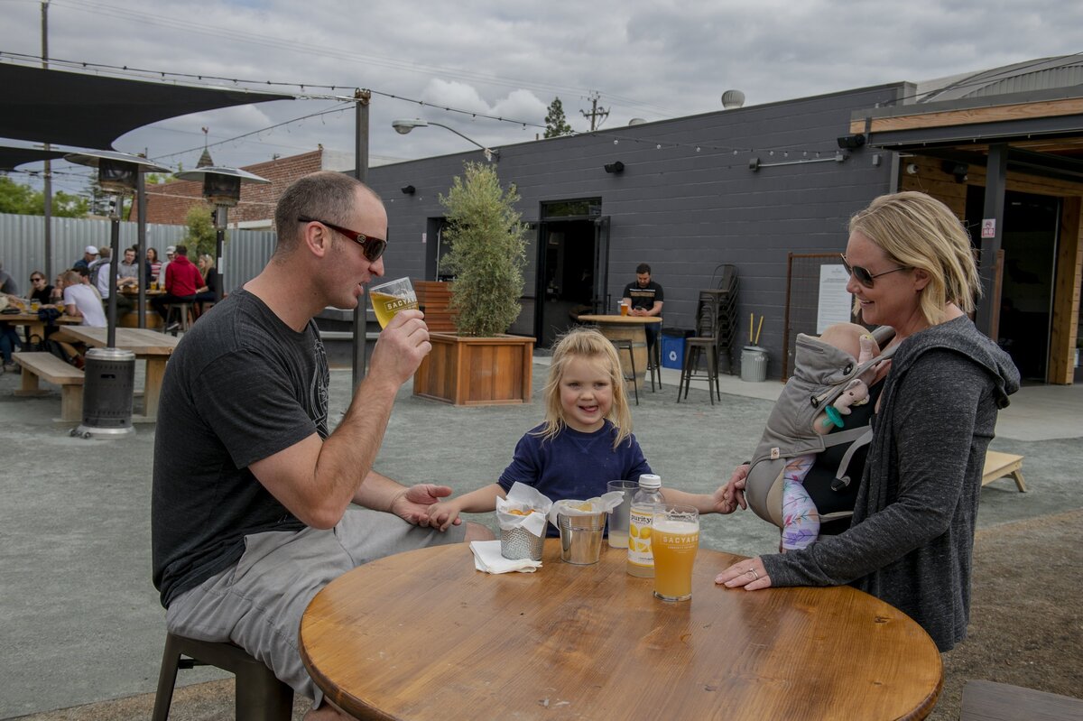 Michael and Heather Wadekamper enjoy Friday afternoon at the SacYard Tap House with their children. The tap house allows children in the outdoor patio and front area.