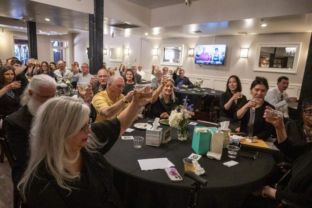 Friends and family toast Dick Cable, the late News10 anchor who died in February 2026, at The Invitation Room in Old Sacramento on Saturday.