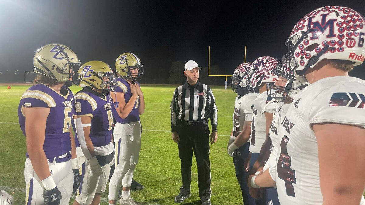 Team captains meet at midfield for the coin toss prior to a CIF Sac-Joaquin Section Division VI playoff game between Bradshaw Christian and Union Mine high schools Friday, Nov. 10, 2023, in Sacramento.