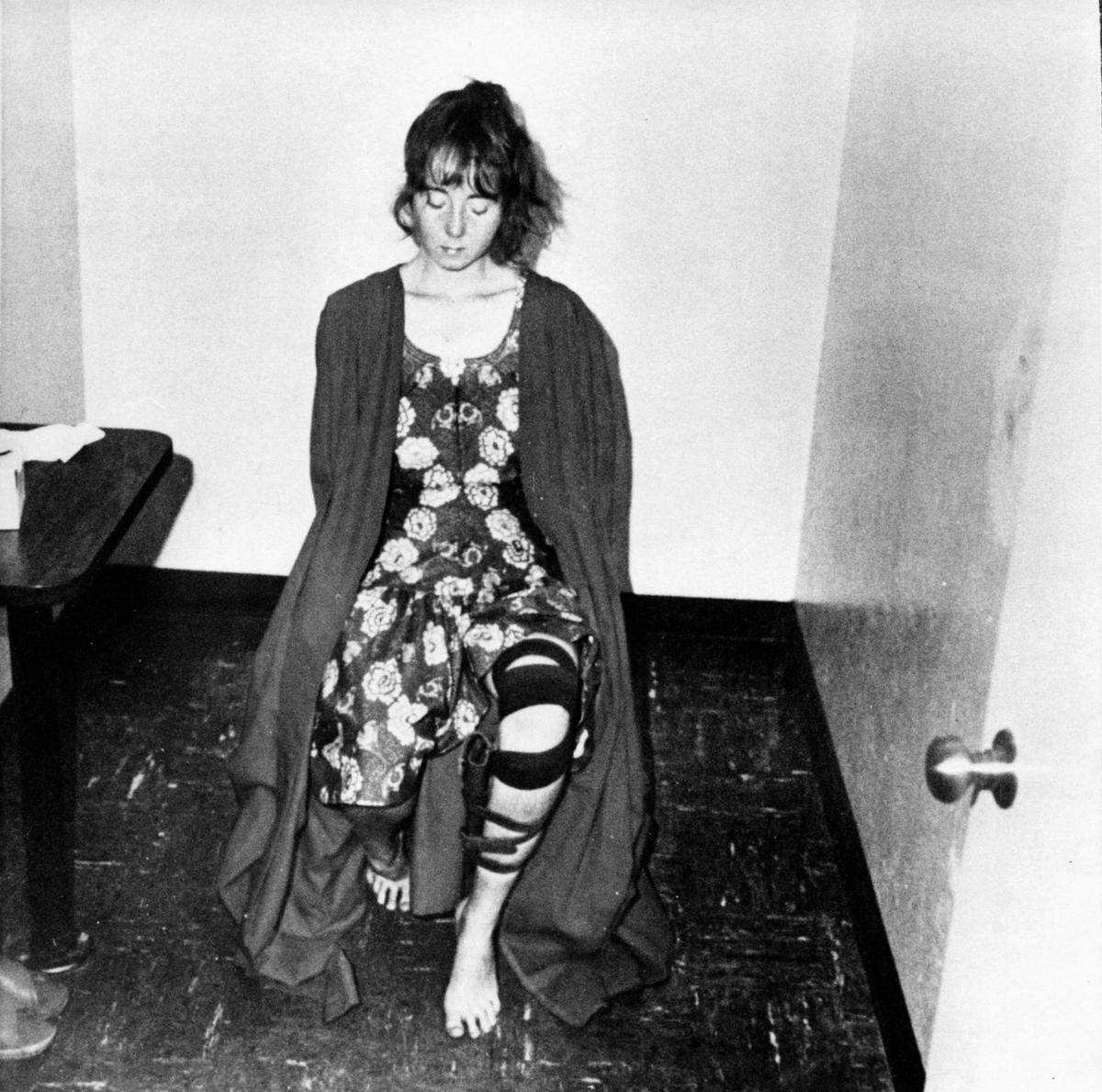 Lynette " Squeaky " Fromme, with an empty holster strapped to her leg, sits in an interrogation room shortly after she was taken into custody following her Sept. 5, 1975, attempt to shoot President Gerald Ford.
