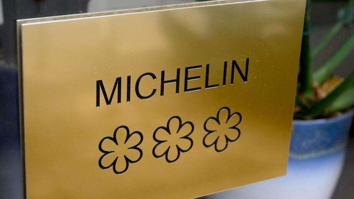 A plaque displaying the three stars of the Michelin guide, the highest award of the French gastronomy (Photo by NICOLAS TUCAT/AFP via Getty Images)