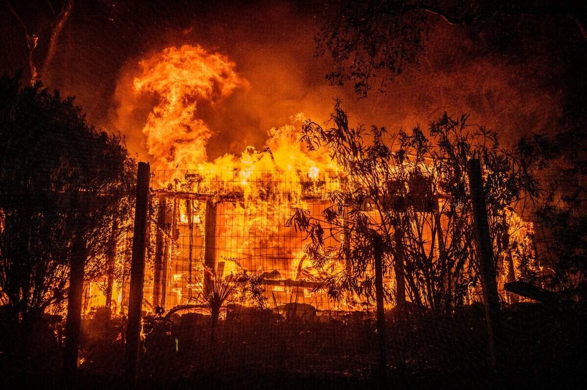 The Glass Fire engulfs a home near Silverado Trail in Napa Valley early Tuesday morning, Sept. 29, 2020.
