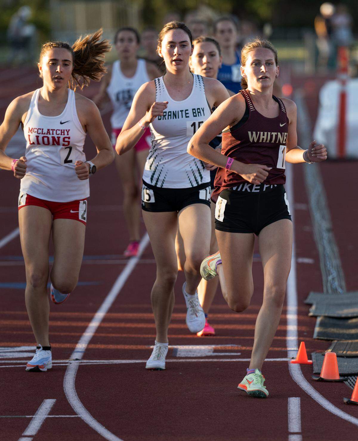 Whitney’s Katie Kopec, right, McClatchy’s Anna McNatt, left, and Granite Bay’s Carly Foster, middle, compete in the 3200 meter race during the CIF Sac-Joaquin Section Masters track finals at Davis High School on Saturday. Kopec won the race with a time of 10:44.82.