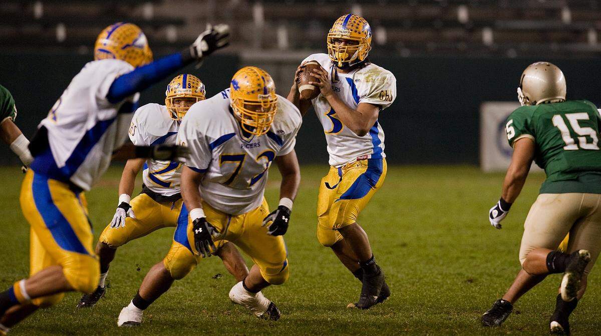 Grant Pacers quarterback Kipeli Koniseti looks to pass behind strong protection against Long Beach Poly in the CIF Open Division bowl game in 2008. 