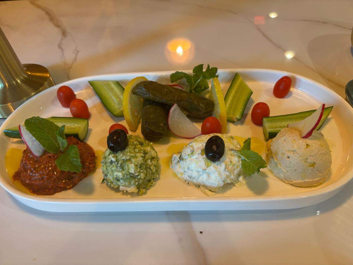 Pera Mezze House in Roseville specializes in Turkish and Greek fare. The chef mix mezze plate offers a taste of four of the restaurant’s signature dips – hummus, baba ganoush, Cretan feta spread and muhammara – as well as two dolmades. In this photo, the baba ganoush is replaced with tzatziki.