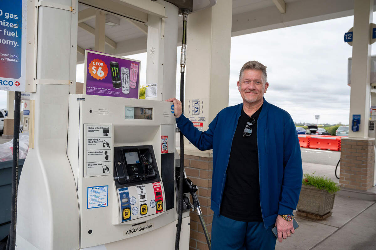 Eric LaVaughn, president of the CharVaughn Group, who manage the Arco gas station at the Sacramento International Airport, stands near a pump in April.