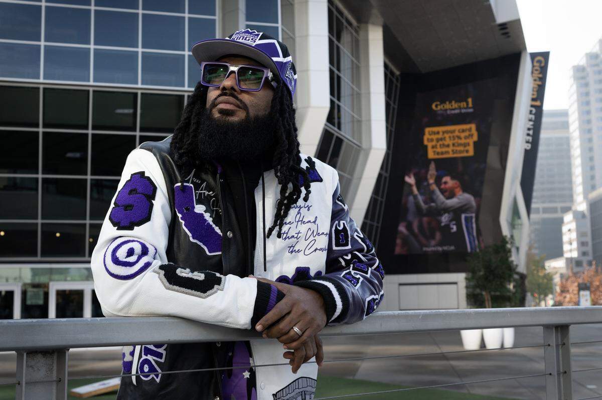 Sacramento Kings superfan Devlin Carter poses for a portrait outside Golden 1 Center in Sacramento on Tuesday, Dec. 2, 2025, wearing Kings–inspired clothing he designed and wears to games. Carter was involved in a heated exchange with Kings' player Zach LaVine and left the Nov. 26 game following the incident, which later went viral.