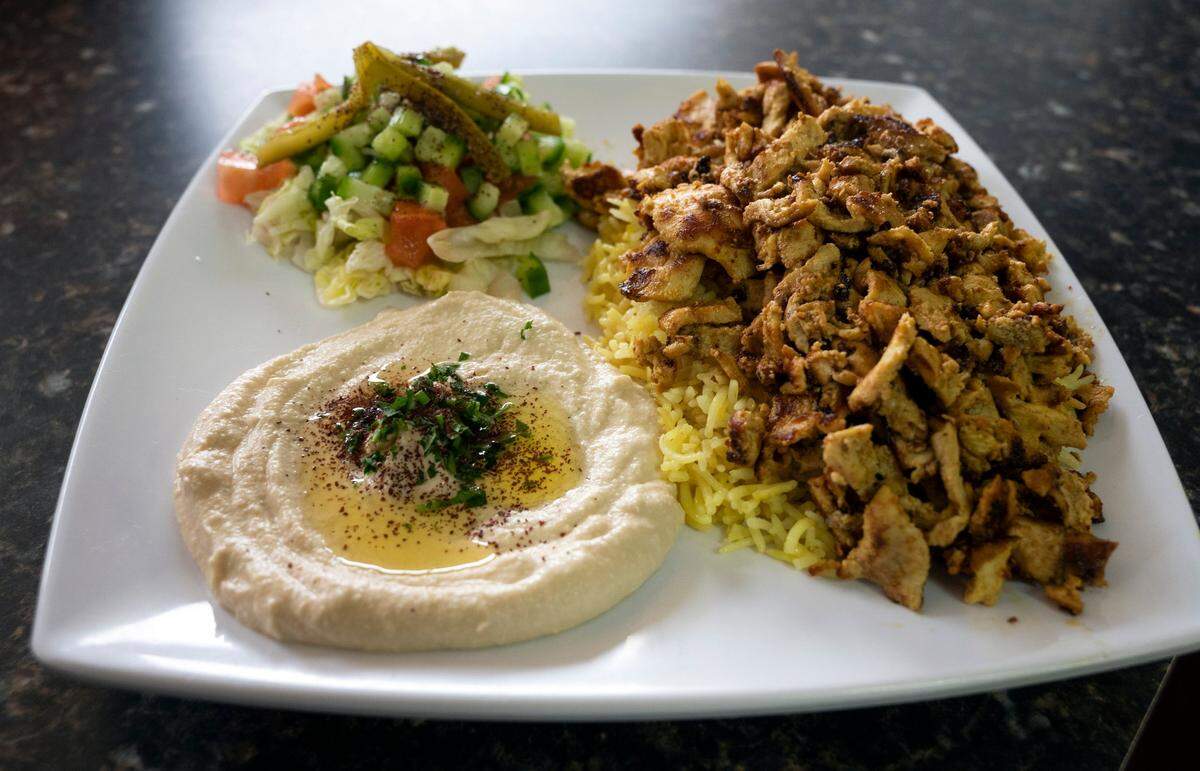The chicken shawarma plate is served with rice and hummus with either fries or salad at Adam’s International Market in Elk Grove on Feb. 11, 2021. The market is known for its Mediterranean-style food, imported groceries and fresh meats.