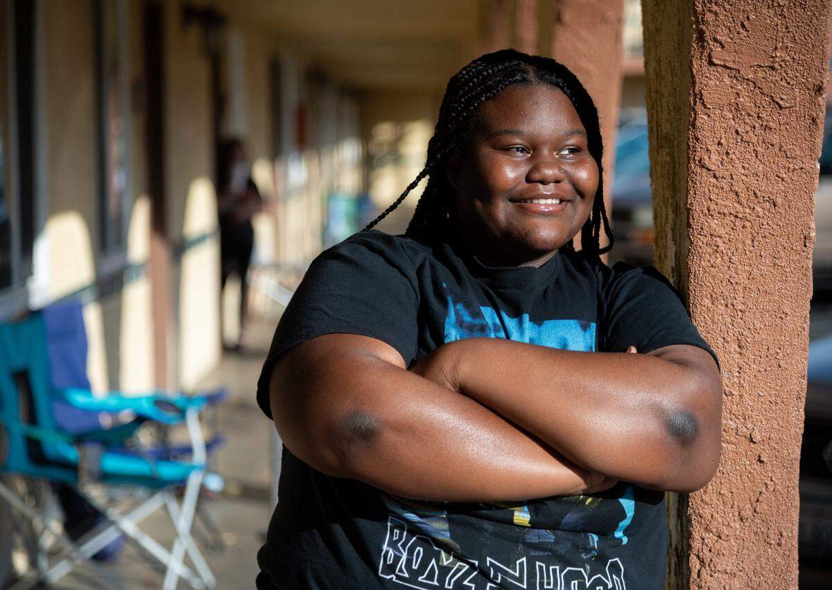 Hiram W. Johnson High School student Monique Young is stands outside her home in Sacramento earlier this month. She was a freshman when the pandemic began in March 2020. Previously a good student, she struggled with distance learning, failing some classes and getting Ds in others. She’s now a junior, hoping to get into UC Merced or a historically Black college or university.