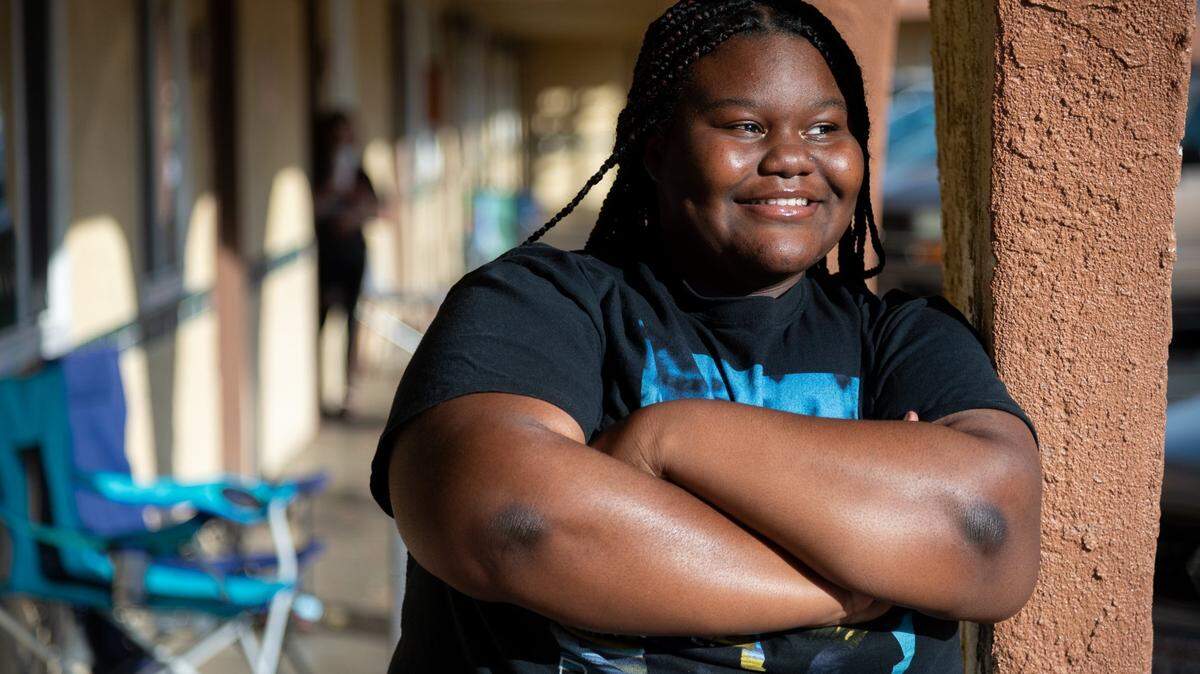 Hiram W. Johnson High School student Monique Young is stands outside her home in Sacramento earlier this month. She was a freshman when the pandemic began in March 2020. Previously a good student, she struggled with distance learning, failing some classes and getting Ds in others. She’s now a junior, hoping to get into UC Merced or a historically Black college or university.