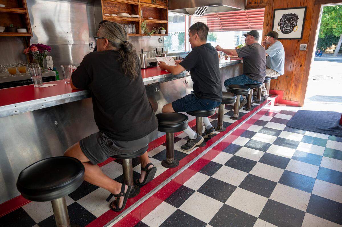 Customers dine inside Jim-Denny’s on Sept. 27, 2023, weeks after the Sacramento landmark reopened.Owner N’Gina Guyton said the diner, which had shut down in 2020, would again close following an eviction notice from the building’s owner.