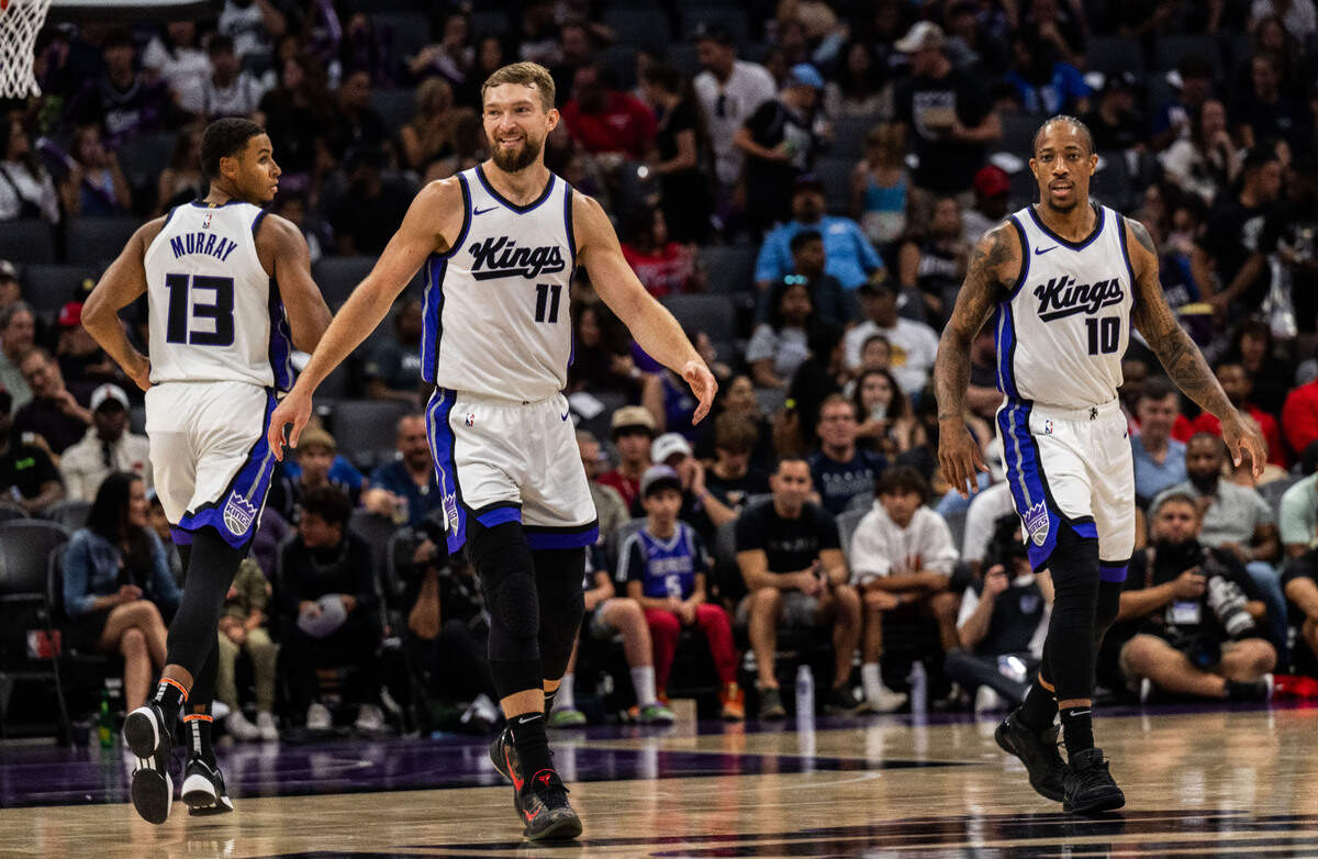 Sacramento Kings forward Keegan Murray (13), center Domantas Sabonis (11) and forward DeMar DeRozan (10) set up their defense during a preseason NBA game Sunday, Oct. 13, 2024, at Golden 1 Center.