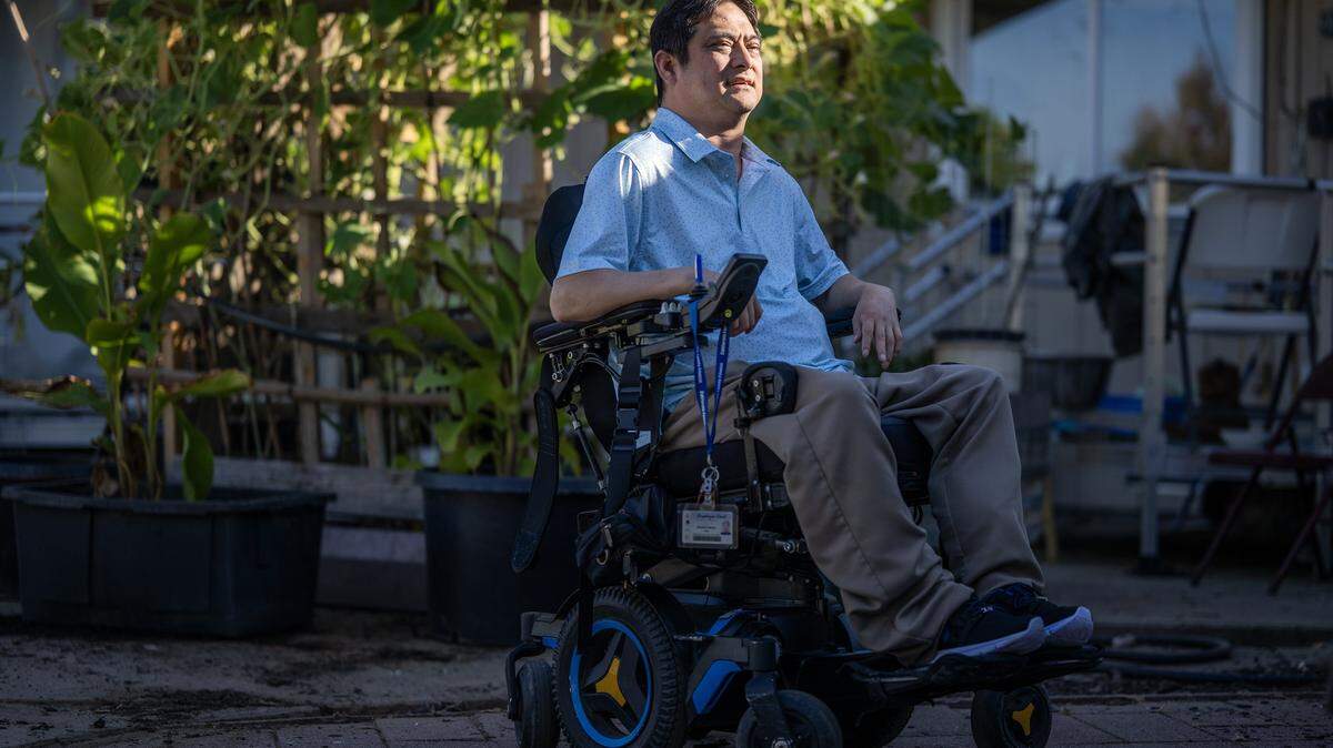 Alfonso Nguyen, a plaintiff in a lawsuit filed in 2022 against SMUD for allegedly sharing energy usage with local law enforcement, poses for a portrait in his yard in Elk Grove on Thursday, July 31, 2025. Nguyen uses an electric wheelchair that needs to be charged regularly, and uses the cooler and heater throughout the year because his body has difficulty regulating his body temperature due to a disability.