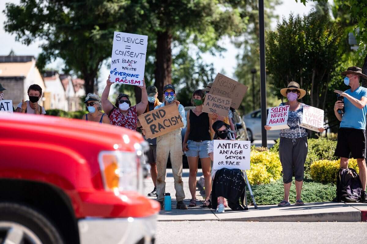 Protesters rally against racial injustice in Colfax on Wednesday, June 10, 2020, for the second time in as many weeks in the rural Placer County city. Passing traffic appeared largely supportive, with only a few people shouting for protesters to go home, get jobs or accusing some of being paid to attend.