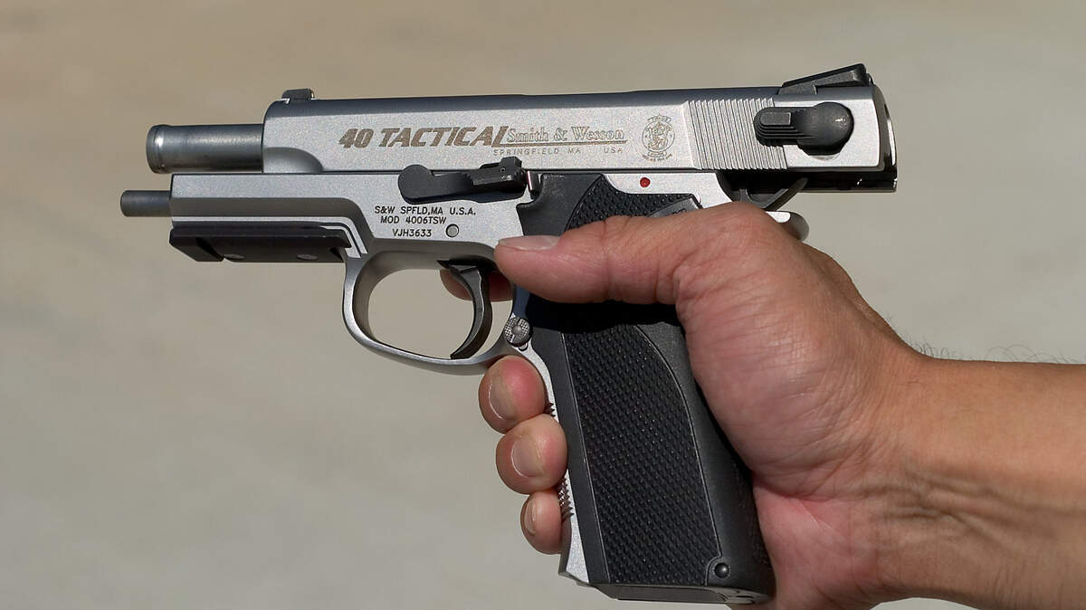 A California Highway Patrol officer demonstrates a CHP sidearm at the academy range in West Sacramento on Tuesday May 16, 2006. The new gun is a Smith and Wesson .40 caliber TSW.