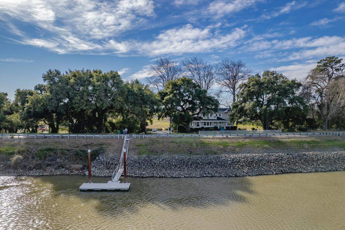 The property comes with a boat dock and direct river access.