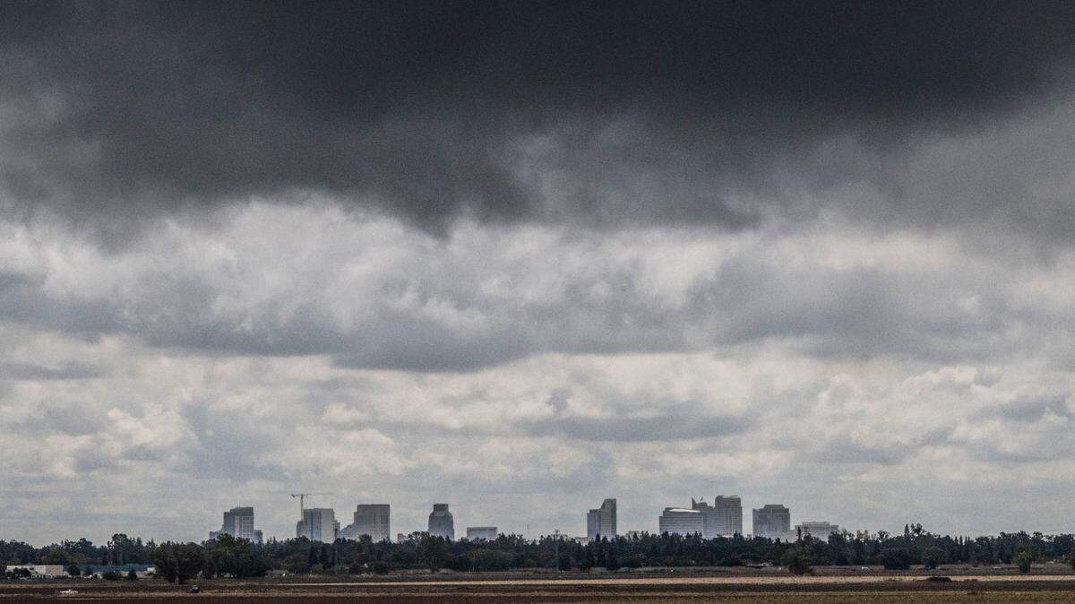 Rain clouds roll past the Sacramento skyline as seen from the Garden Highway near San Juan Road on Monday, Sept. 19, 2022.