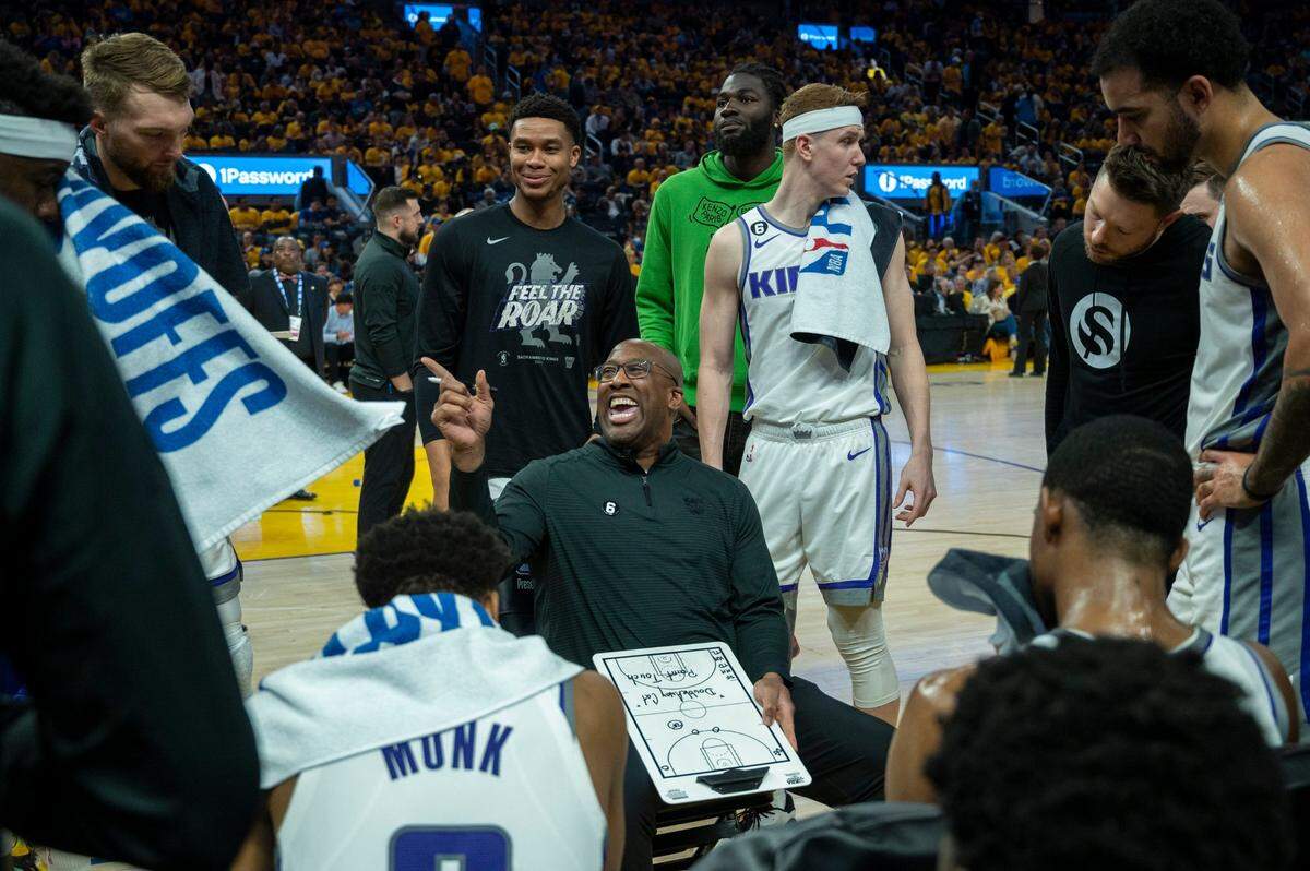 Sacramento Kings coach Mike Brown talks to players during a fourth-quarter timeout in Game 6 of the NBA playoff series at Chase Center in April.
