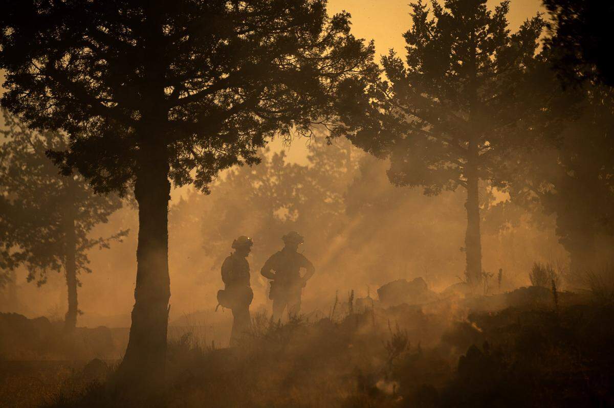 Firefighters look for hot spots while battling the Lava Fire in Siskiyou County.