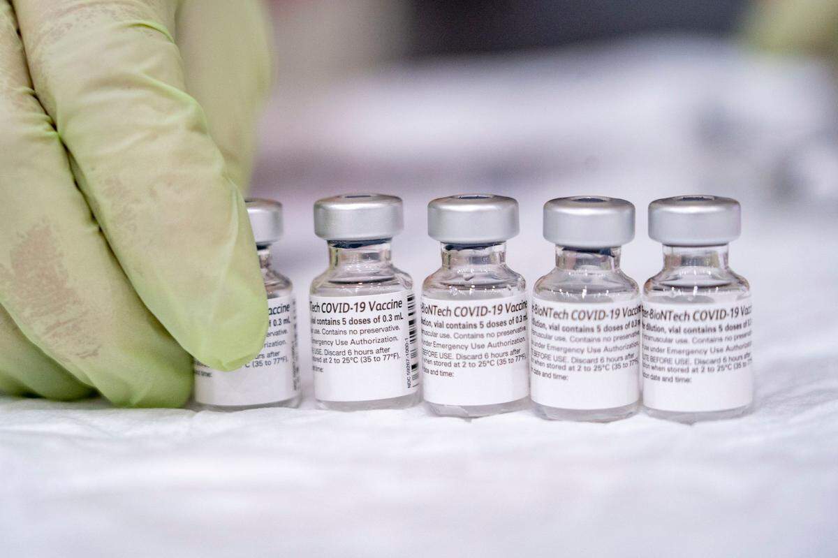 Bottles of the Pfizer COVID-19 vaccine as they are being prepped for use by Mercy Health employee Kelley Williams on Saturday, Feb. 20, 2021, at Del Campo High School in Fair Oaks during a vaccine clinic held by the San Juan Unified School District in partnership with Dignity Health. The clinic is expected to vaccinate 2000 district employees and community members over 65.