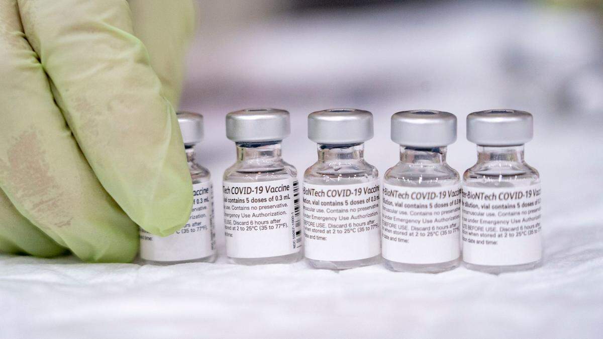 Bottles of the Pfizer COVID-19 vaccine as they are being prepped for use by Mercy Health employee Kelley Williams on Saturday, Feb. 20, 2021, at Del Campo High School in Fair Oaks during a vaccine clinic held by the San Juan Unified School District in partnership with Dignity Health. The clinic is expected to vaccinate 2000 district employees and community members over 65.